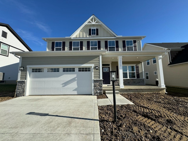 view of front facade featuring a porch and a garage