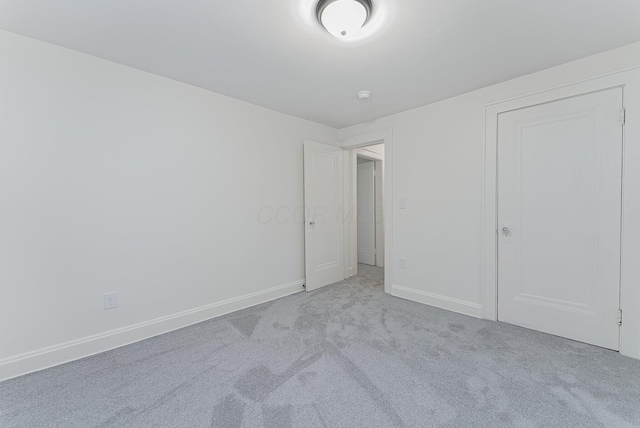 unfurnished bedroom with light carpet