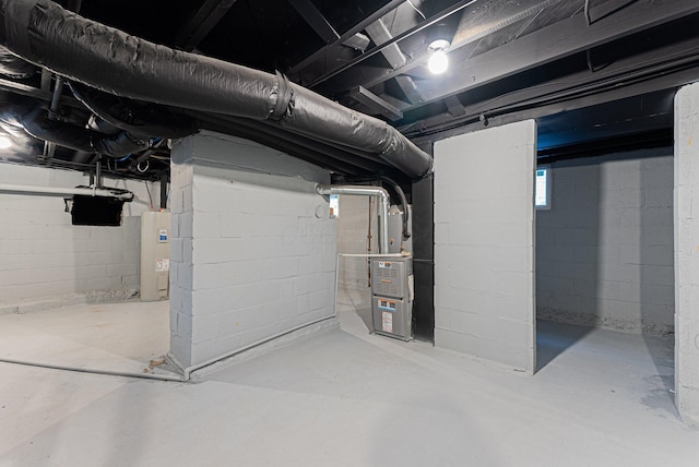 basement featuring electric water heater