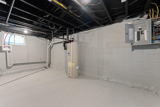 basement featuring electric water heater and electric panel