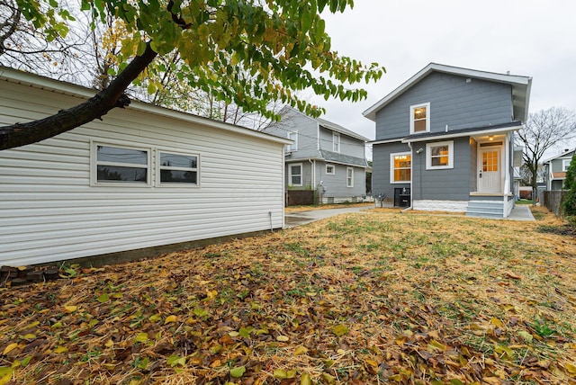 rear view of house with a lawn