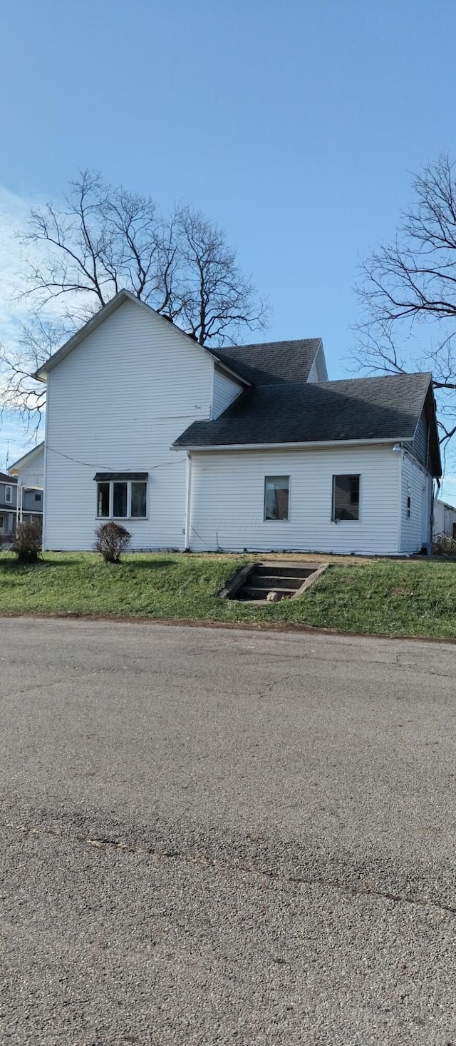 view of home's exterior with a lawn