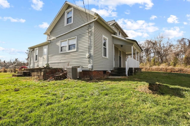 view of home's exterior featuring a yard and central AC unit