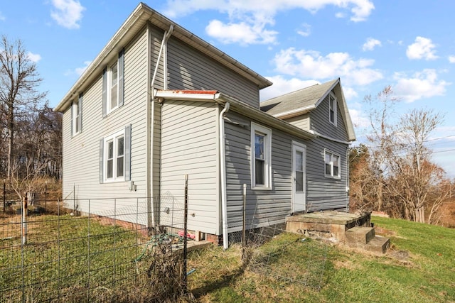 view of property exterior featuring a yard