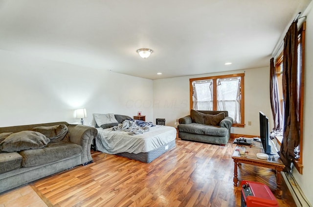 bedroom with hardwood / wood-style flooring