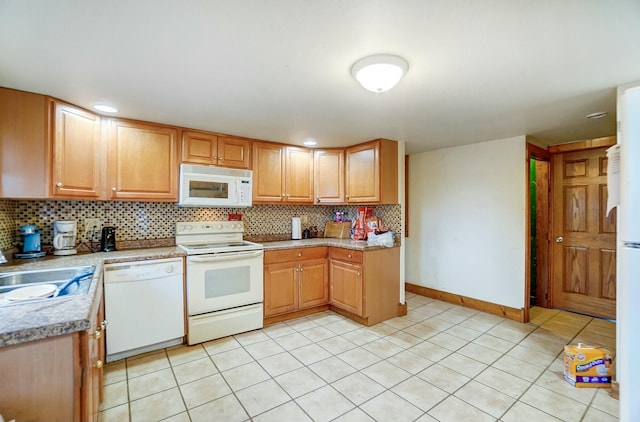 kitchen featuring sink, white appliances, light tile patterned flooring, and backsplash