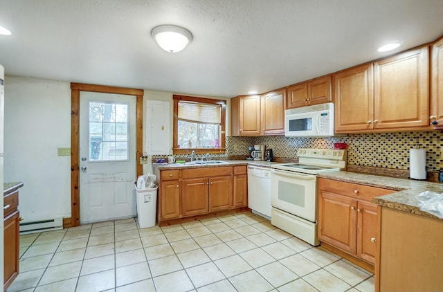 kitchen with light stone countertops, sink, a baseboard radiator, white appliances, and decorative backsplash