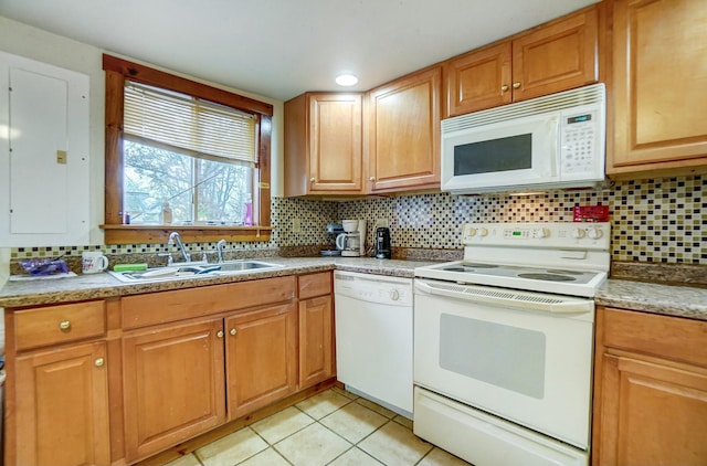 kitchen with decorative backsplash, light tile patterned floors, white appliances, and sink