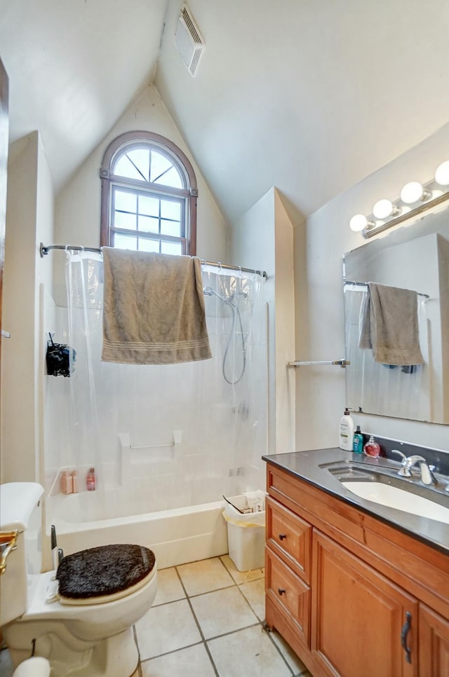 full bathroom with tile patterned flooring, lofted ceiling, toilet, vanity, and tiled shower / bath