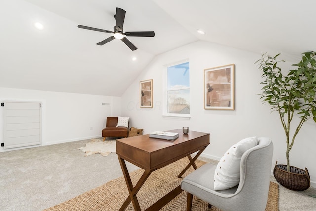 office featuring light carpet, lofted ceiling, and ceiling fan