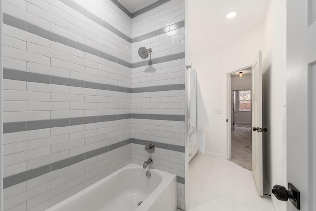 bathroom with tile patterned floors and tiled shower / bath