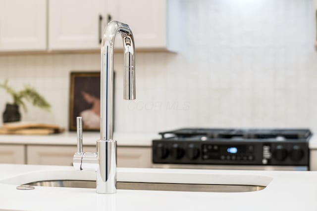 details featuring white cabinetry