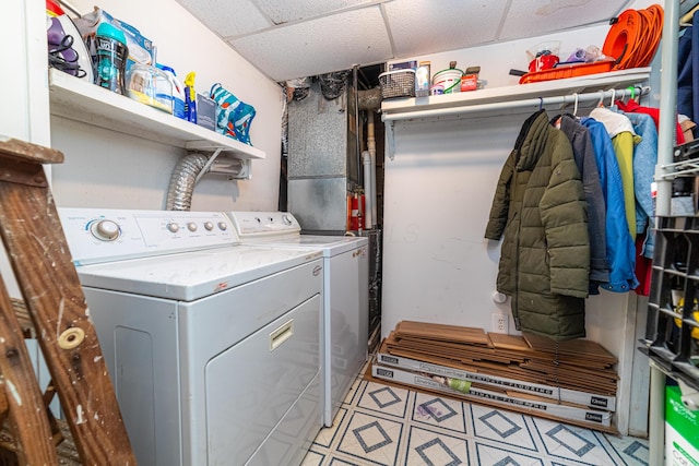 clothes washing area featuring separate washer and dryer