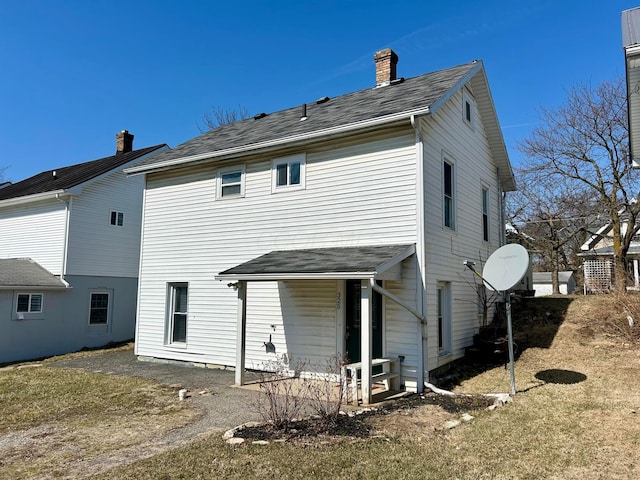 rear view of house with a chimney