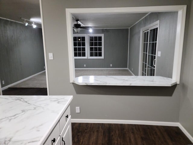 bathroom with hardwood / wood-style flooring and ceiling fan