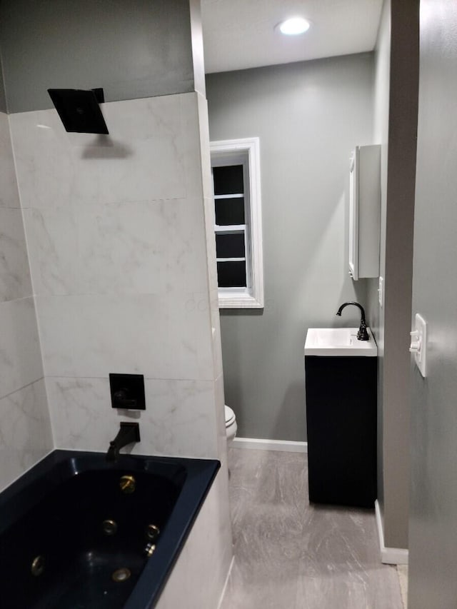 bathroom with vanity and toilet