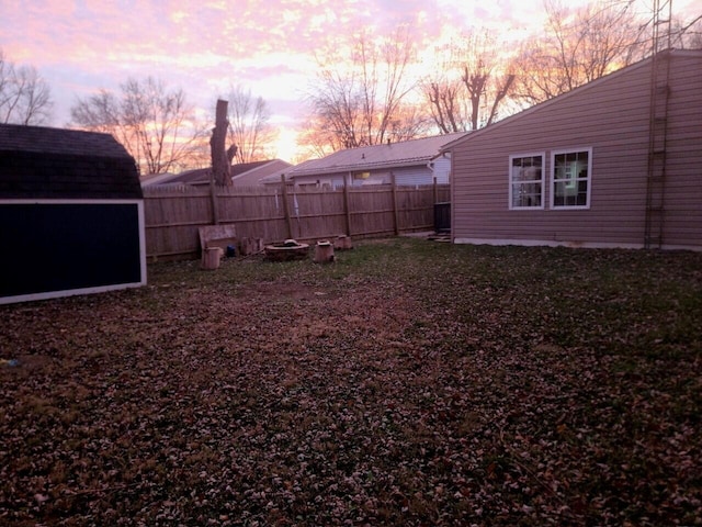 yard at dusk with a shed