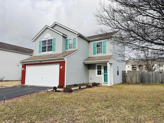 traditional-style home with driveway, a garage, fence, a front lawn, and brick siding