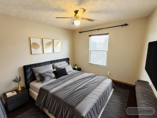 bedroom with ceiling fan, a textured ceiling, baseboards, and wood finished floors