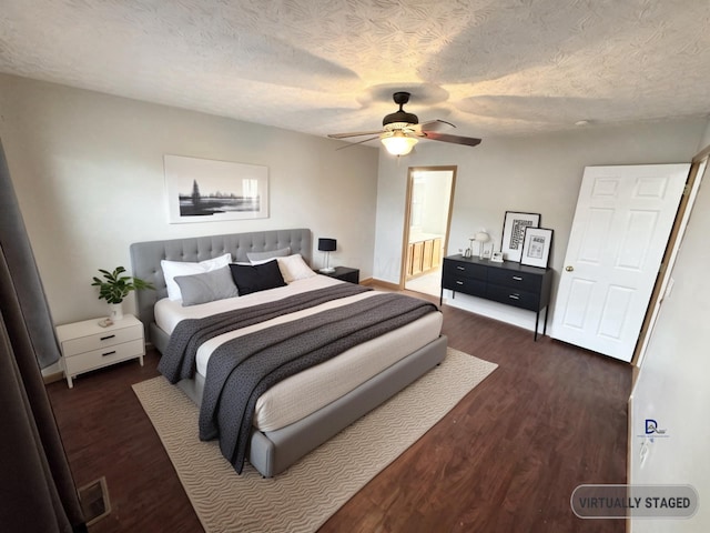 bedroom featuring connected bathroom, ceiling fan, a textured ceiling, wood finished floors, and baseboards