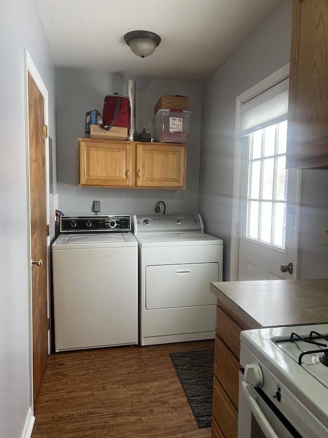 laundry room with dark hardwood / wood-style flooring and washer and clothes dryer