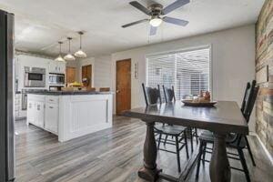 dining area featuring ceiling fan and hardwood / wood-style flooring