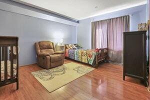 bedroom with hardwood / wood-style flooring