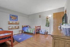 bedroom with hardwood / wood-style flooring