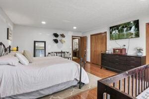 bedroom with hardwood / wood-style flooring