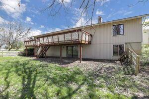 back of property with a wooden deck