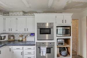 kitchen featuring white cabinetry and stainless steel appliances