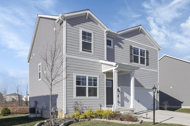 view of front facade with cooling unit and a garage