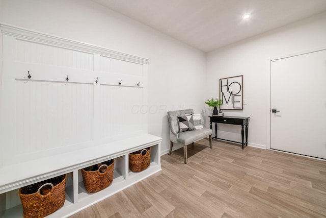 mudroom with light hardwood / wood-style floors