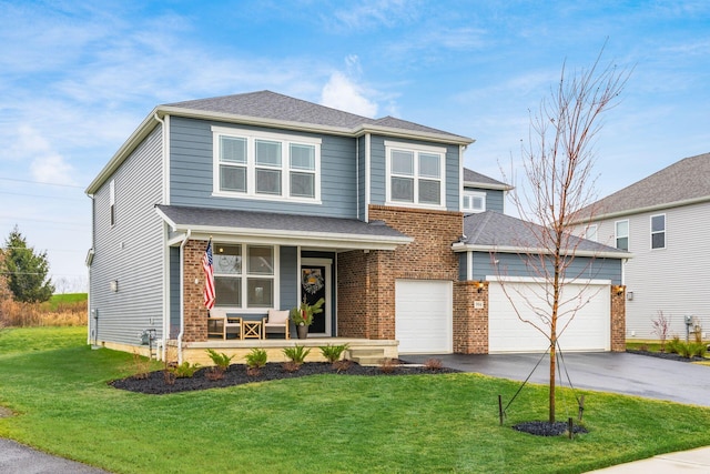 view of front facade with a porch, a garage, and a front yard