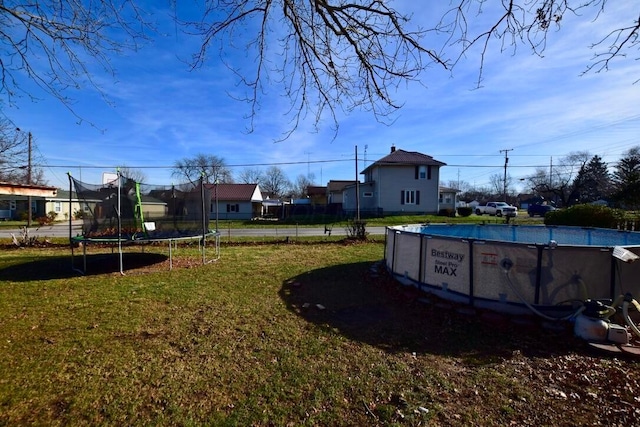 view of yard with a trampoline