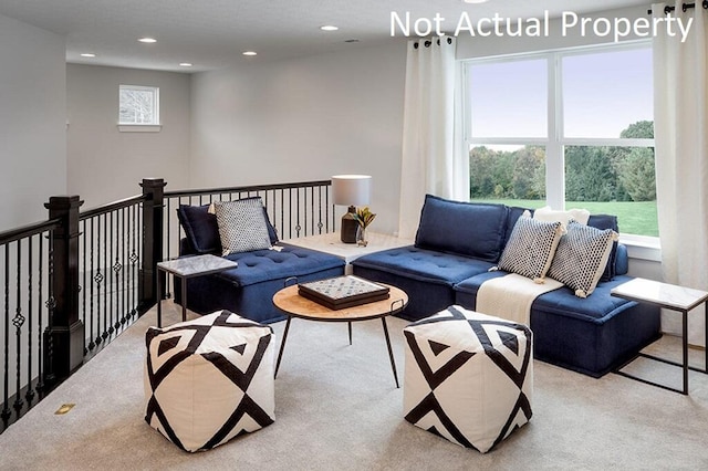 living area featuring recessed lighting and carpet flooring