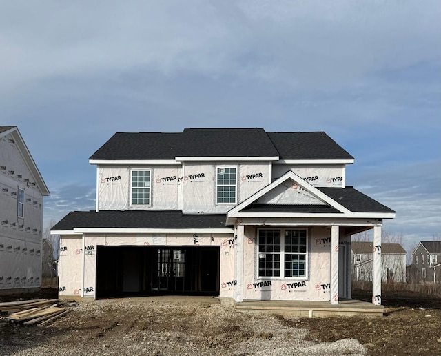 unfinished property with a garage