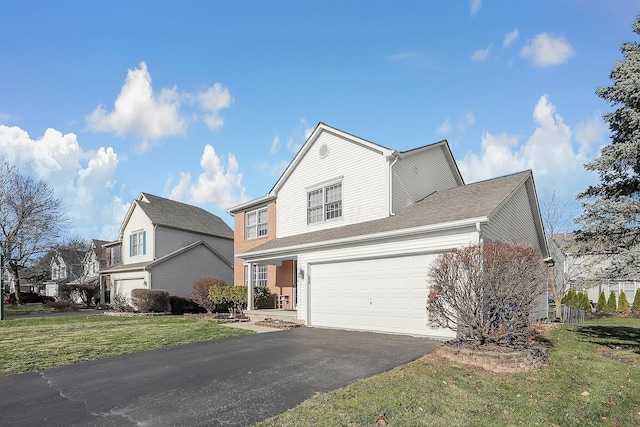 6184 Pirthshire St, Dublin, OH 43016 - traditional home with a garage, aphalt driveway, and a front yard