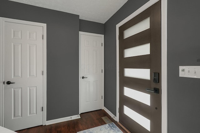 6184 Pirthshire St, Dublin, OH 43016 - interior space featuring baseboards, a textured ceiling, and dark wood-type flooring