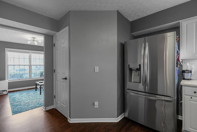 6184 Pirthshire St, Dublin, OH 43016 - kitchen with white cabinets, stainless steel refrigerator with ice dispenser, baseboards, and dark wood finished floors