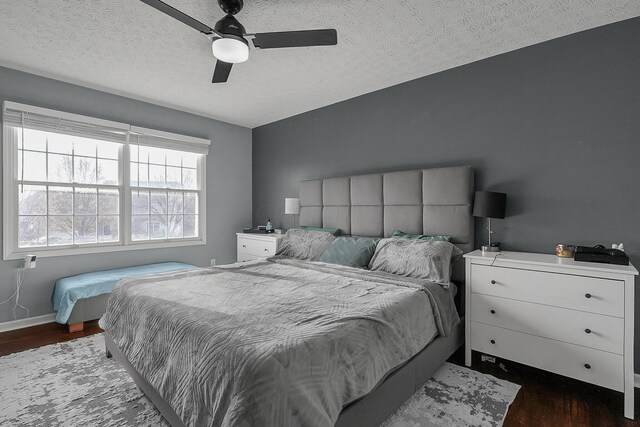 6184 Pirthshire St, Dublin, OH 43016 - bedroom with baseboards, a textured ceiling, dark wood finished floors, and ceiling fan
