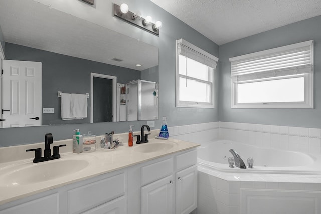 6184 Pirthshire St, Dublin, OH 43016 - bathroom with a jetted tub, a sink, double vanity, and a shower stall