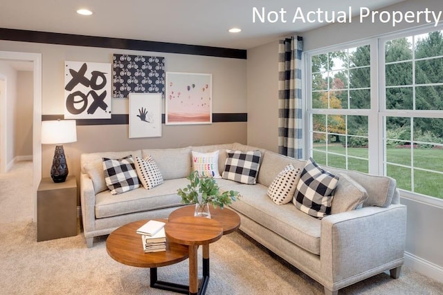 living room with recessed lighting, baseboards, and carpet floors