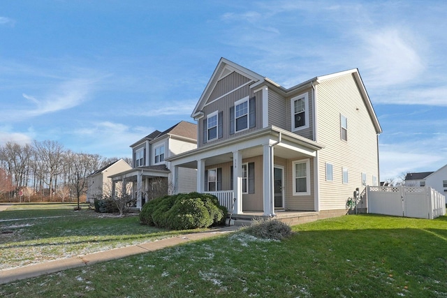 view of front facade with a front lawn and covered porch