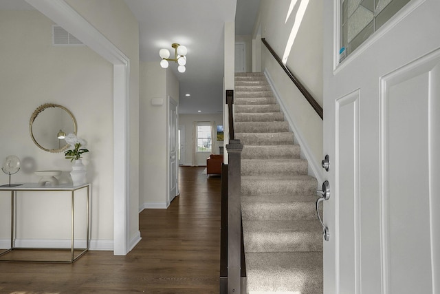 stairs with wood-type flooring