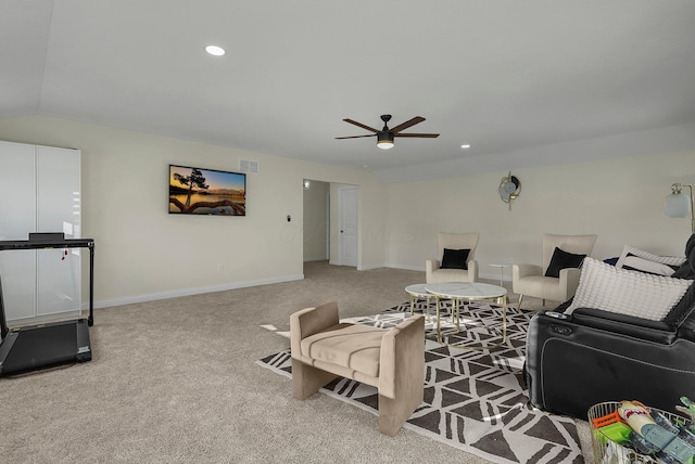 carpeted living room with vaulted ceiling and ceiling fan