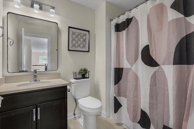 bathroom with a shower with curtain, tile patterned flooring, vanity, and toilet