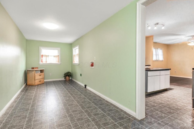 laundry area with hookup for a washing machine, plenty of natural light, and ceiling fan