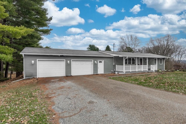 ranch-style house with covered porch and a garage