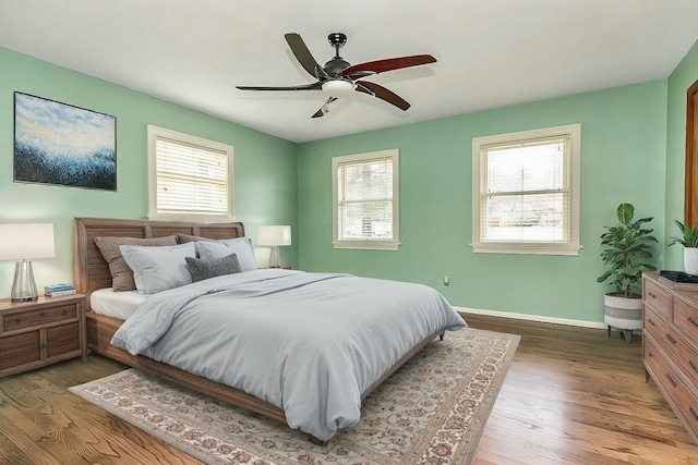 bedroom featuring wood-type flooring and ceiling fan